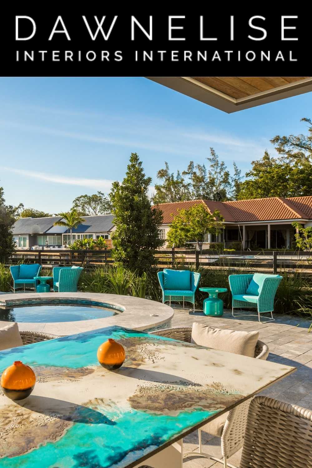 SL B DawnElise Pin An outdoor living room featuring the Etna dining table from Seasonal Living by DawnElise Hamilton